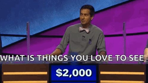 Man In Front Of Sign Saying What Is Things You Love To See Alex $2,000 GIF