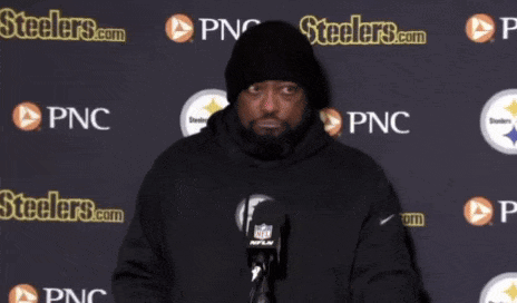 Man in Front of Steelers.com Wall