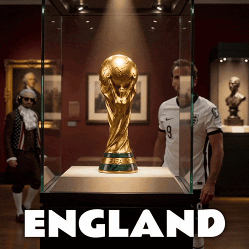 Man in Front of Trophy Saying England
