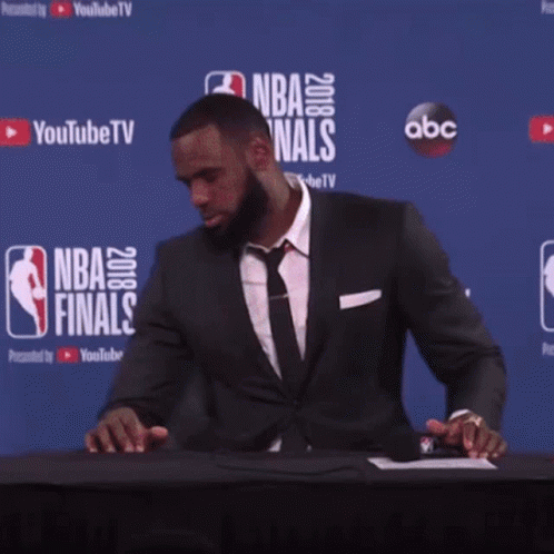Man in Front of Wall Saying NBA Finals