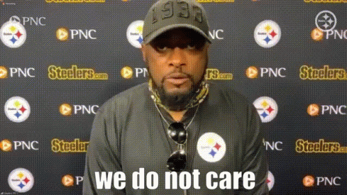Man in Front of Wall With Steelers Logos