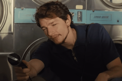Man in Front of Washing Machine Saying Speed Dry