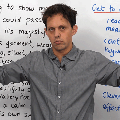 Man in Front of White Board Saying Get To