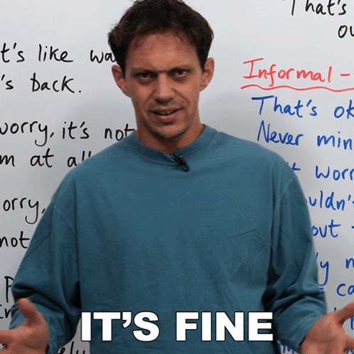 Man in Front of White Board Saying It's Fine