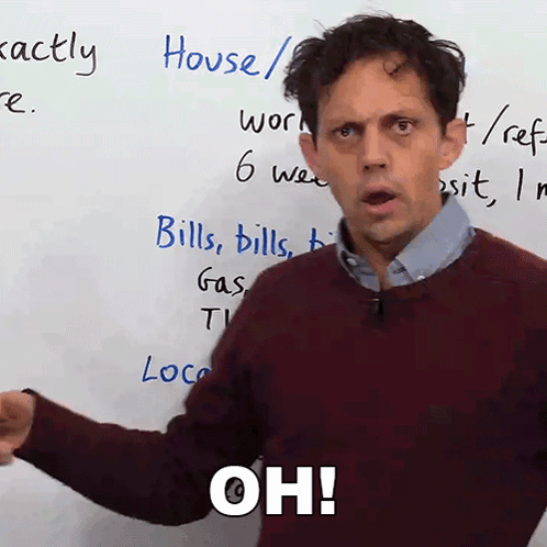 Man in Front of White Board With Oh