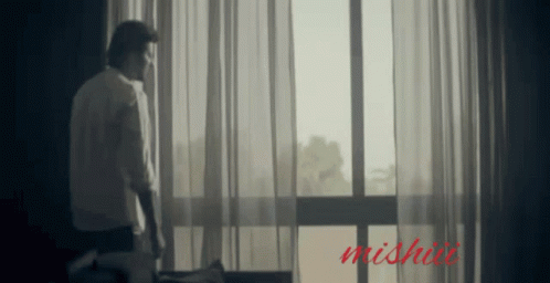 Man In Front Of Window With Word Mishai GIF