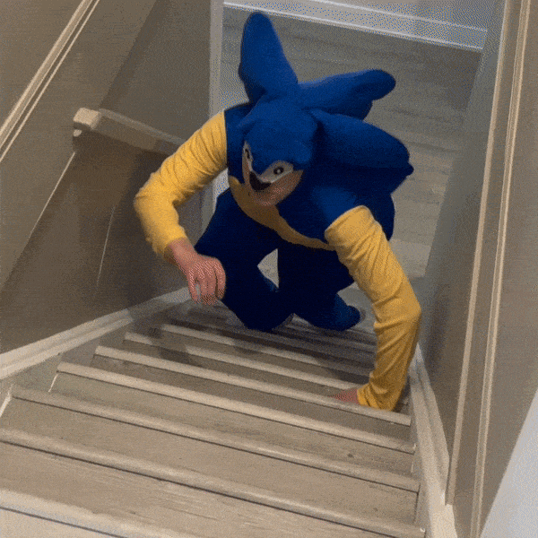 Man In Funny Sonic Costume Crawling Up Stairs GIF
