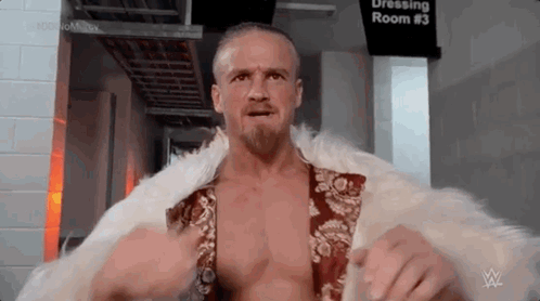 Man in Fur Coat and Beard in Dressing Room