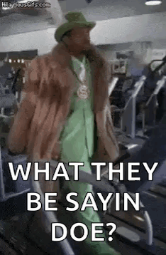 Man In Fur Coat And Green Suit On Treadmill GIF