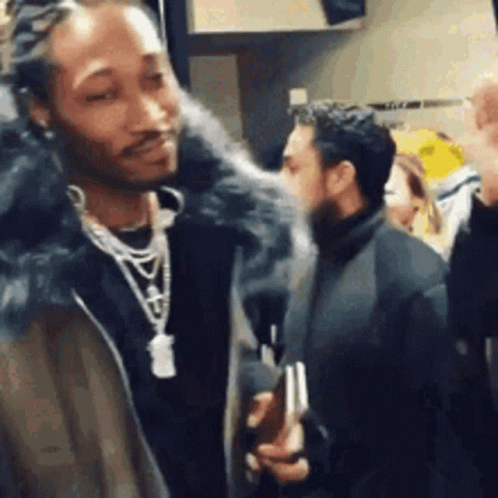 Man in Fur Coat Talking to Crowd