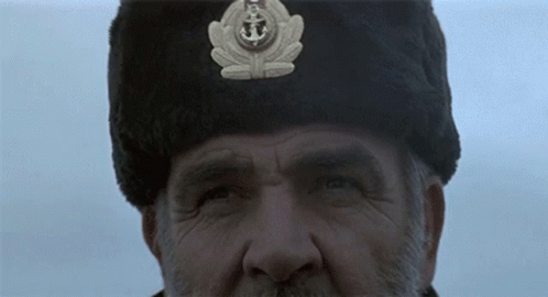 Man In Fur Hat With Anchor GIF