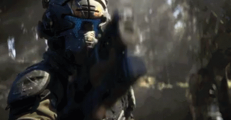 Man in Futuristic Helmet Pointing Gun