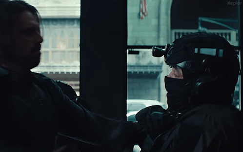 Man in Gas Mask Fighting Another Man