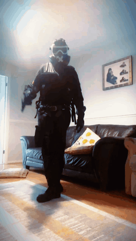 Man in Gas Mask in Living Room