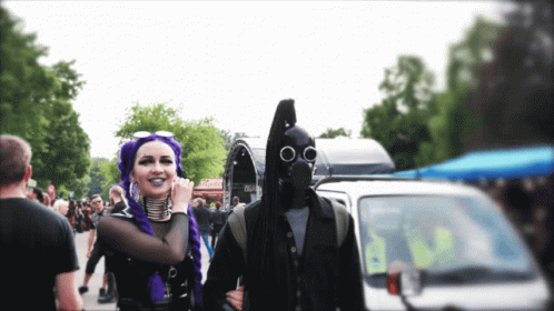 Man In Gas Mask Next To Woman GIF