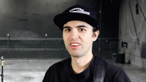 Man in Genuine Hat Looks at Camera