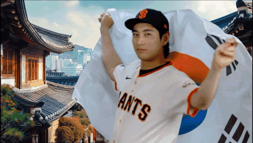 Man in Giants Jersey Holding Korean Flag