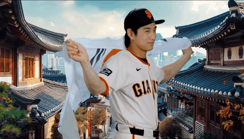 Man in Giants Jersey in Front of Korean Temple