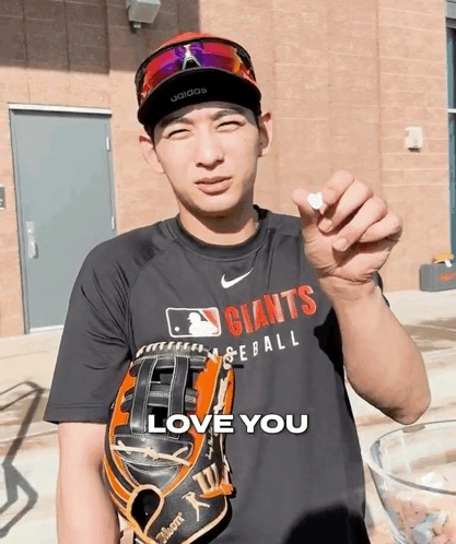Man in Giants Shirt Holding Baseball Glove