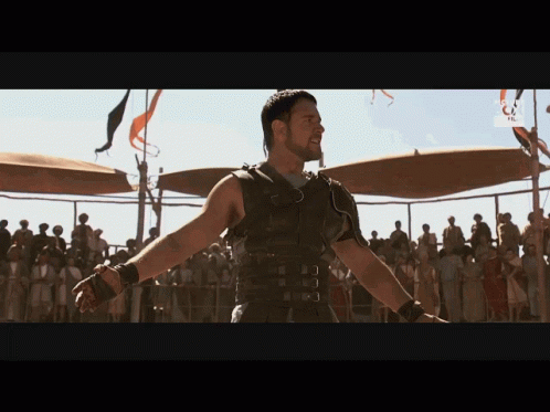 Man in Gladiator Costume Before Crowd With RTL