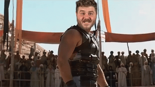 Man in Gladiator Costume in Front of Crowd