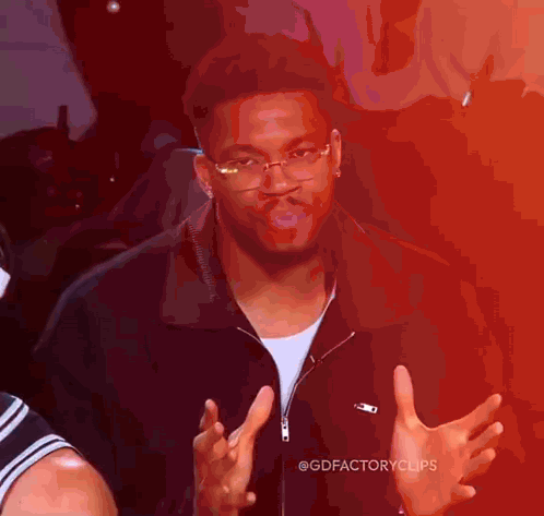 Man in Glasses and Black Jacket Making Funny Face