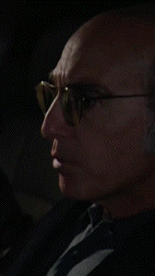 Man in Glasses and Black Shirt by Window