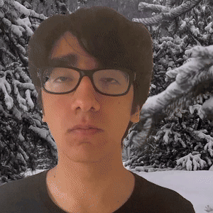 Man In Glasses And Black Shirt In Snowy Trees GIF