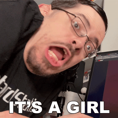 Man in Glasses and Black Shirt Saying It's a Girl