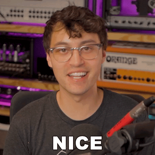 Man In Glasses And Black Shirt Saying Nice GIF