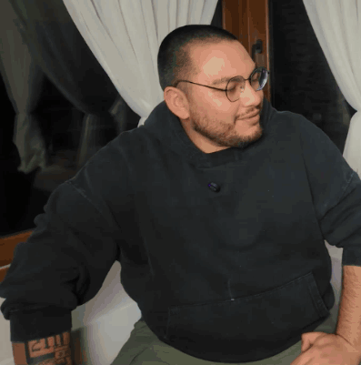 Man In Glasses And Black Sweatshirt Saying 2011 GIF