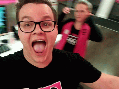 Man in Glasses and Black T-Shirt T-Mobile