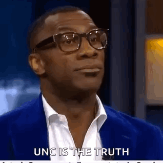 Man in Glasses and Blue Jacket Talking Truth