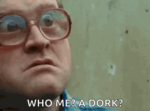 Man in Glasses and Blue Shirt Saying Who Me A Dork
