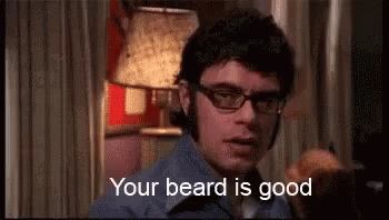 Man in Glasses and Blue Shirt Saying Your Beard Is Good