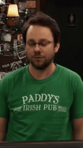 Man in Glasses and Green Paddy's Irish Pub Shirt
