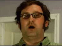Man In Glasses And Green Shirt Open Mouth GIF