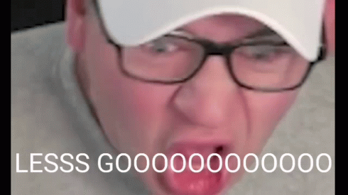 Man in Glasses and Hat Making Funny Face