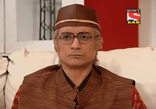 Man in Glasses and Hat on Couch With Sony SAB Ad