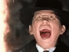 Man in Glasses and Hat Screaming With Mouth Open