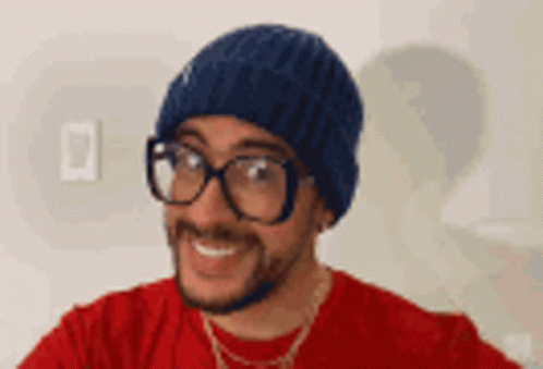 Man in Glasses and Hat Smiling