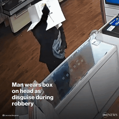 Man In Glasses And Hat With Another In Dark Room GIF