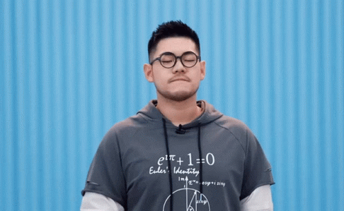 Man in Glasses and Hoodie Saying e t + 1 = 0