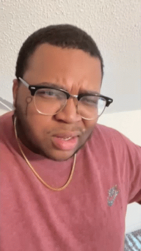 Man In Glasses And Nike Shirt Making Face GIF