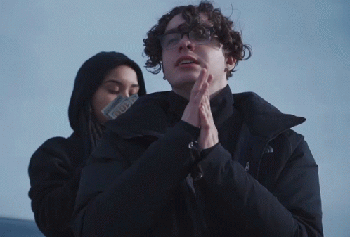 Man in Glasses and North Face Jacket Next to Woman