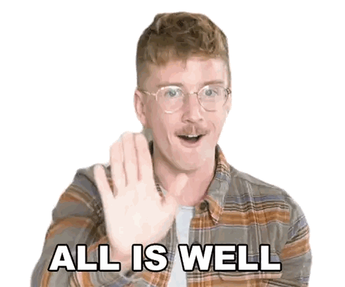 Man In Glasses And Plaid Shirt Saying All Is Well