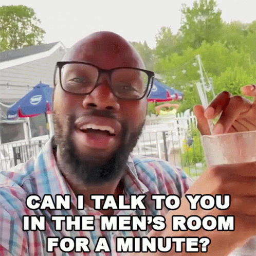 Man in Glasses and Plaid Shirt Says Can I Talk to You in the Men's Room for a Minute