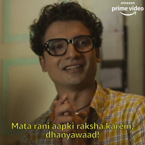 Man in Glasses and Plaid Shirt Says Mata Rani Aapki Raksha Karein Dhanyawaad