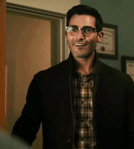 Man in Glasses and Plaid Shirt Smiling