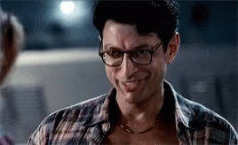 Man in Glasses and Plaid Shirt Smiling at Woman